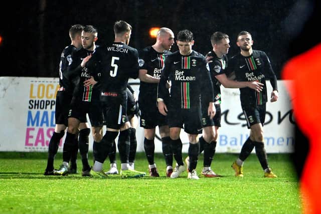 Glentoran’s Ruaidhri Donnelly celebrates after he fires his side into a 3-1 lead against Ballymena United.