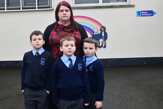 Parent Joyce Holmes with her children Daniel, Adam and Mathew Shields   as The Education Authority (EA) plans to shut Kingsmill’s Primary school in County Armagh in August due to the falling number of pupils and a rising financial deficit.