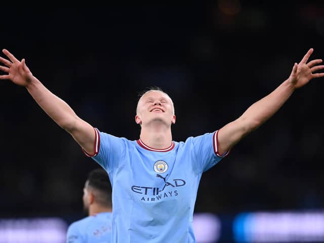 Erling Haaland celebrates setting a Premier League goals record in Manchester City’s victory over West Ham United