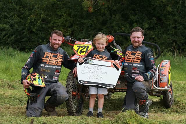 Ulster sidecar champions Neil Campbell and Ross Graham pictured with their biggest fan Casey. PIC: STEPHEN DAVISON