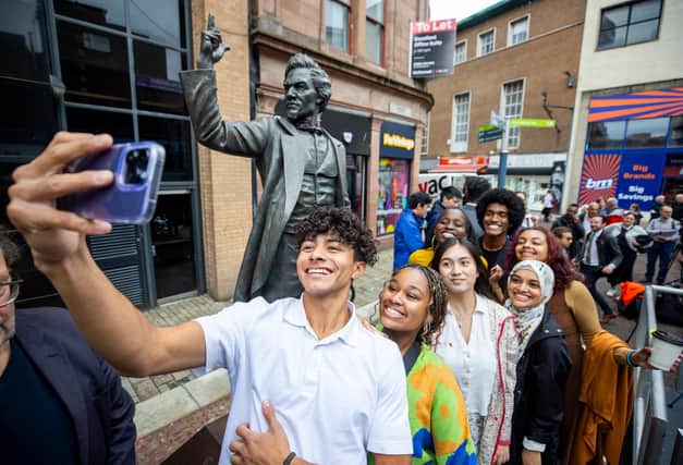 2023 Frederick Douglass Global Fellow, Daniel Hernandez, takes a selfie with other Douglass Global Fellows during the unveiling of a statue of anti-slavery campaigner Frederick Douglass in Belfast. Photo: Liam McBurney/PA Wire