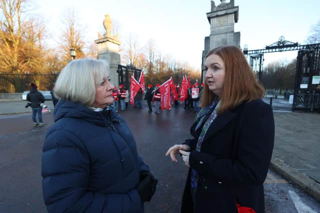 General Secretary of Northern Ireland Public Service Alliance (NIPSA), Carmel Gates (left), speaking with Head of the NI Civil Service Jayne Brady on the picket line outside the gates of the Stormont Estate, as an estimated 150,000 workers take part in walkouts over pay across Northern Ireland.