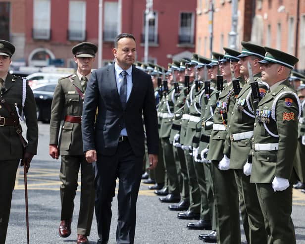 Taoiseach Leo Varadkar inspecting a guard of honour from the Defence Forces prior to the ceremony of reconciliation and remembrance for those who lost their lives during the Civil War in the Garden of Remembrance in Dublin