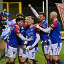 Linfield players celebrate Chris McKee's winner against Cliftonville at Solitude