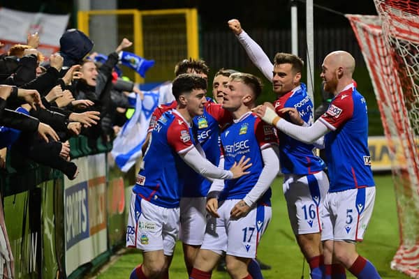 Linfield players celebrate Chris McKee's winner against Cliftonville at Solitude