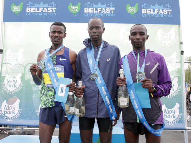 Winner of the mens race in the Moy Park Belfast City Marathon - Mathew Kiplimo Kemboi (centre) second place Bahrain’s Aweke Ayalew Yimer (left) and third place Moses Kilmulwo Tuyange