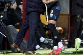 Rangers' James Tavernier is given a hug by his manager, Danny Rohl, after being substituted during the William Hill Premiership match at Fir Park, Motherwell. (Photo by Steve Welsh/PA Wire)