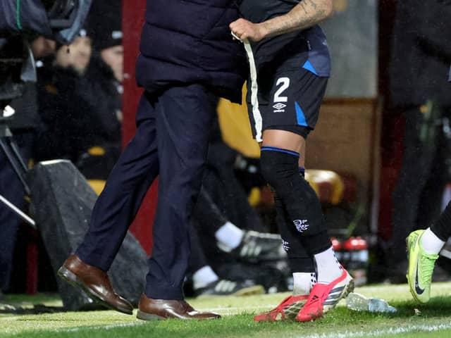 Rangers' James Tavernier is given a hug by his manager, Danny Rohl, after being substituted during the William Hill Premiership match at Fir Park, Motherwell. (Photo by Steve Welsh/PA Wire)