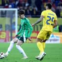 Northern Ireland’s Trai Hume with Romania’s Florinel Coman in the international friendly clash in Bucharest