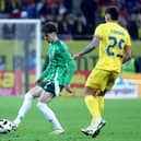 Northern Ireland’s Trai Hume with Romania’s Florinel Coman in the international friendly clash in Bucharest