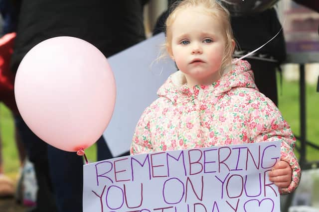 Harleigh Taylor, two, during a memorial event Chloe Mitchell at King George's Park, Ballymena