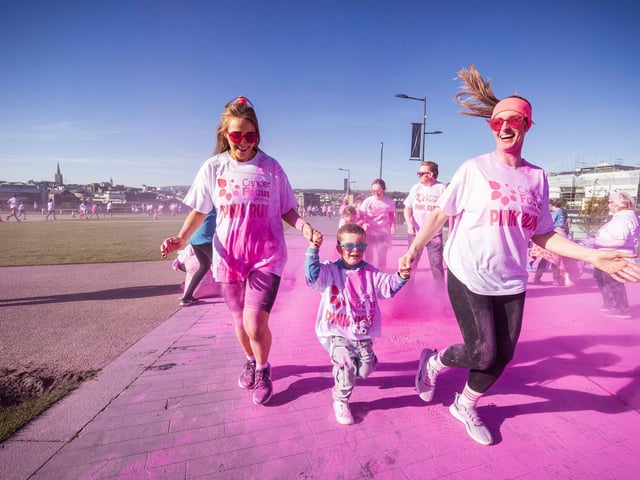 Runners, walkers, and pooches were splashed in pink powder from head to toe for a great cause as Cancer Focus NI’s first Pink Run took place in Londonderry. Picture Steven McAuley/McAuley Multimedia