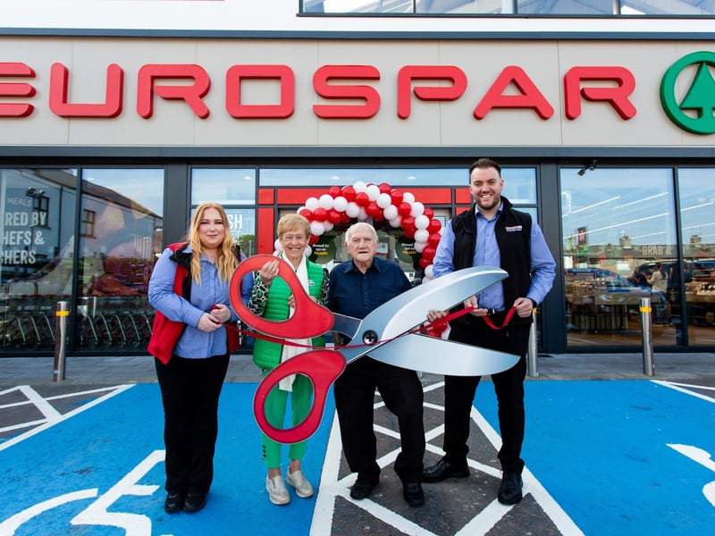 Loyal customers Mary Graham and Merwyn Hanna (centre) officially reopen the all-new Eurospar Greencastle Street in Kilkeel alongside store manager John Fox and community representative Chelsea Robinson
