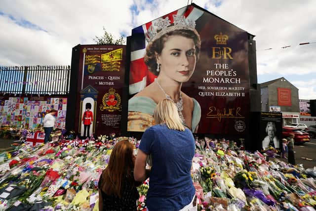 PA REVIEW OF THE YEAR 2022

File photo dated 10/09/22 - Members of the public gather to pay their respects on Belfast's Shankill Road following the death of Queen Elizabeth II on Thursday. Issue date: Tuesday December 20, 2022. PA Photo. Photo credit should read: Brian Lawless/PA Wire 
