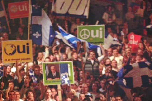 Quebec has had two referenda on independence - supporters of it above in a Yes rally in Montreal in October 1995. As a rule, when a majority backs secession in such a vote in a country, the result is irreversible (AP Photo/Paul Chiasson)