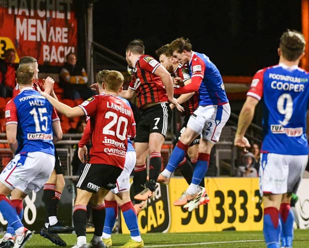 Daniel Finlayson (second right) scores to send Linfield top of the Sports Direct Premiership table with a dramatic injury-time victory by 2-1 over Crusaders at Seaview. (Photo by Andrew McCarroll/Pacemaker Press)