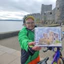 Timmy Mallett in Carrickfergus with his painting of the castle
