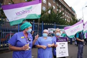 Unison members taking part in a protest outside the Royal Victoria Hospital in Belfast in August. PA Photo. Photo by Niall Carson/PA Wire