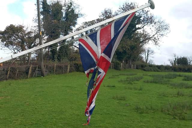 The PSNI is treating the cutting down of a flag pole and the burning of a Union Flag in Rathfriland as a hate crime.