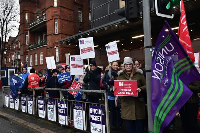 Nurses go on strike at the Mater Hospital in Belfast in December 2019.
 About 15,500 nurses in Northern Ireland have begun strike action in a dispute over pay and patient safety.
