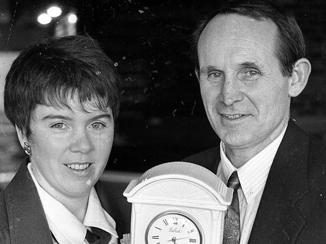 Patricia McCauley, manageress of the Belleek Pottery Visitors’ Centre, and Jim Nelson, manager of Antrim Senior Hurling team, pictured at the end of February 1992, with a Belleek clock, one of the many valuable prizes which were to be won at the Belleek Antrim Celebrity Golf Open which was to take place at Cushendall Golf Club on Saturday, April 25, 1992. Picture: News Letter archives