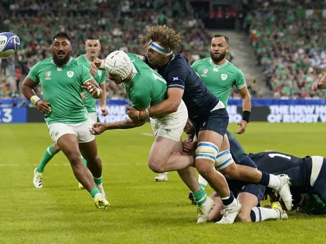 Ireland's Mack Hansen is tackled by Scotland's Jamie Ritchie during the Rugby World Cup 2023, Pool B match at Stade de France in Paris, France. Picture date: Saturday October 7, 2023. PA Photo. See PA story RUGBYU World Cup Ireland. Photo credit should read: Andrew Matthews/PA Wire.

RESTRICTIONS: Use subject to restrictions. Editorial use only, no commercial use without prior consent from rights holder.