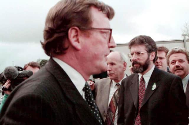 The Ulster Unionist Party leader, David Trimble and Sinn Fein President, Gerry Adams pass by outside Castle  Buildings, Stormont during a break in the negotiations two days before the signing of the Good Friday Agreement in 1998. The SDLP and the Ulster Unionists then struck a firm deal, with Sinn Fein at the level of constitutional structures having been ignored. Picture Pacemaker