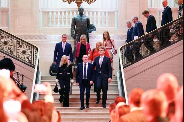 The US ambassador to the UK  Jane Hartley, bottom left on the stairs, and party leaders including Sir Jeffrey Donaldson, top left, descend into the Great Hall at Stormont as part of the US Business Delegation event on Wednesday October 25 2023. The DUP leader could hardly have stayed away. Image taken from Northern Ireland Assembly @niassembly X feed