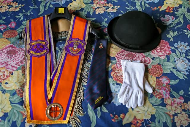 Worshipful District Master of Portadown District Loyal Orange Lodge (LOL) No 1, cattle farmer, husband and father to two children Darryl Hewitt's Orange Order Collarette or Sash,Bowler hat ,tie and parade gloves lie on his bed early on Sunday morning 7th July on his farm outside Portadown Co.Armagh. Later he will head into the town centre to lead the annual Orange Order parade to Drumcree Parish Church.:-