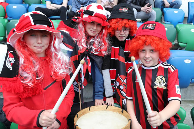 Young Crusaders fans celebrate their team winning the Irish Cup