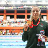 Ellie McCartney of Team Northern Ireland celebrates with her Gold Medal after the Women's 100m Backstroke Final on day two of the 2023 Youth Commonwealth Games at National Aquatic Centre in Couva, Trinidad And Tobago