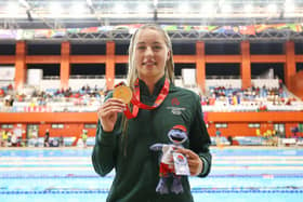 Ellie McCartney of Team Northern Ireland celebrates with her Gold Medal after the Women's 100m Backstroke Final on day two of the 2023 Youth Commonwealth Games at National Aquatic Centre in Couva, Trinidad And Tobago