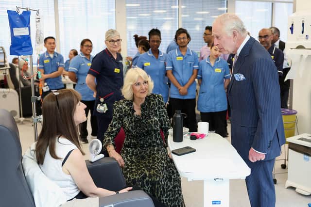 King Charles and Queen Camilla meet with patient Jo Irons during a visit to University College Hospital Macmillan Cancer Centre