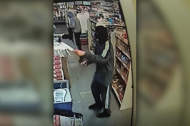 The image of this robber brandishing a large knife was released following a hold-up at Virk’s Convenience Store in Elmton Road, Creswell. 
Two masked robbers entered the shop at around 6.10pm on December 9.
The pair threatened staff with large knives and left with bottles of alcohol. 
A number of cars were in the area at the time the pair made their escape and officers are keen to hear from any drivers who may have dashcam footage of them.