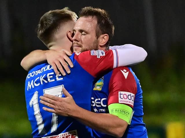 Linfield captain Jamie Mulgrew celebrates with goal-scorer Chris McKee following Friday's final whistle and victory over Cliftonville. (Photo by Colm Lenaghan/Pacemaker)