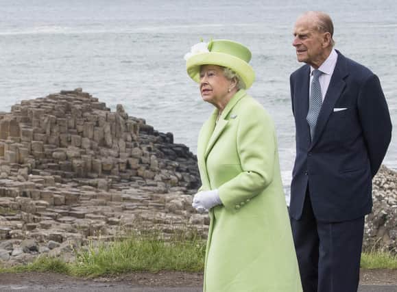 Queen Elizabeth II and Prince Philip, Duke Of Edinburgh visit the Giants Causeway on June 28, 2016 in County Antrim, Northern Ireland, United Kingdom.  (Photo by Arthur Edwards/WPA Pool/Getty Images)