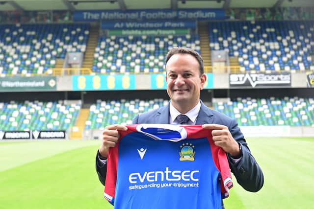 Taoiseach Leo Varadkar  receives a shirt during a visit to Linfield at Windsor Park in Belfast. The Taoiseach got a tour of the club by Linfield representative, and meeting with players from the academy. Pic Colm Lenaghan/Pacemaker