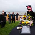 Sue Bamford places a wreath on a box symbolising a coffin as environmental campaigners hold a "wake" at Ballyronan beach for Lough Neagh lake amid claims toxic algae is killing the UK and Ireland's largest freshwater lake. Photo: Liam McBurney/PA Wire