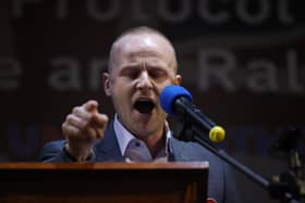 Loyalist blogger Jamie Bryson speaks during a anti Northern Ireland Protocol rally and parade, organised by North Antrim Amalgamated Orange Committee, in Ballymoney, Co Antrim. Picture date: Friday March 25, 2022
