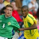 Northern Ireland's Steven Davis and Brazil's Fernandinho pictured at 2003 tournament.