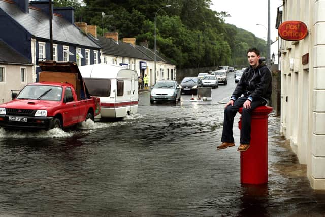 A caravan driver goes through the floods at Crossgar looking to escape the rain in June 2007. Picture: Diane Magill