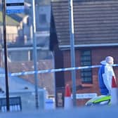 Forensics in the Edward Street area of Lurgan as police launch a murder inquiry. Photo: Colm Lenaghan/Pacemaker