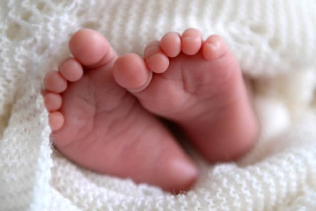 Serious ethical questions have been raised after the first baby was born in the UK with DNA from three people.