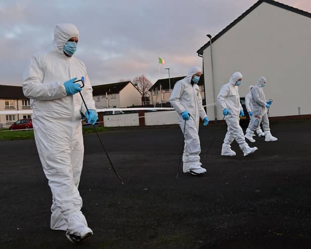 Forensics officers searched the scene of the murder investigation.
Pic Colm Lenaghan/Pacemaker