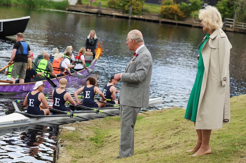 King Charles III and Queen Camilla talk with rowers outside the Enniskillen Castle