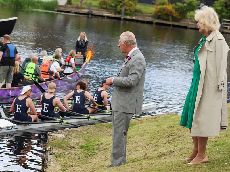 King Charles III and Queen Camilla talk with rowers outside the Enniskillen Castle