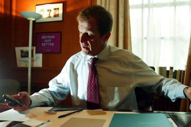 Alastair Campbell is seen in his office in Downing Street after announcing his resignation as Director of Communications to Prime Minister Tony Blair, August 29, 2003 (photo by STEPHEN HIRD/POOL/AFP via Getty Images)