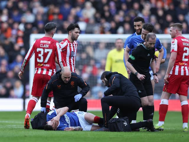 Rangers Ryan Jack receives medical treatment, after being tackled by Nicky Clark of St Johnstone who received a red card as a result. (Photo by Ian MacNicol/Getty Images)