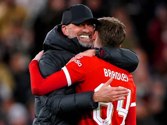 Liverpool manager Jurgen Klopp (left) hugs Conor Bradley at the end of the Carabao Cup semi final first leg match at Anfield, Liverpool. PIC: Peter Byrne/PA Wire.