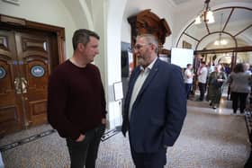 Sinn Fein's John Finucane (left) and DUP leader Doug Beattie speaking at the Northern Ireland council elections at Belfast City Hall on Saturday